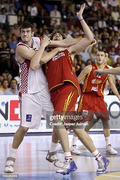 Stanko Barac of Croatia fouls Marc Gasol during the Eurobasket 2007 preliminary round match between Croatia and Spain at the San Pablo Arena on...