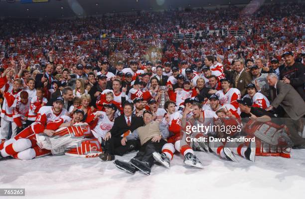 The Detroit Red Wings pose for a team photo with the Stanley Cup after defeating the Carolina Hurricanes during game five of the NHL Stanley Cup...