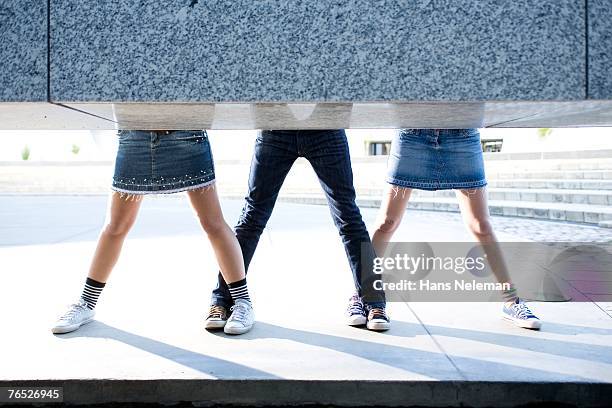 young women with legs apart in sneakers, low section - woman leg spread stock pictures, royalty-free photos & images