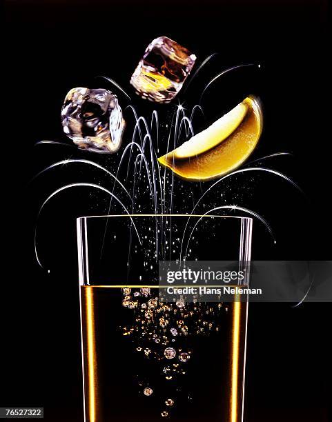 glass with exploding ice cubes and lemons - ice exploding stock pictures, royalty-free photos & images