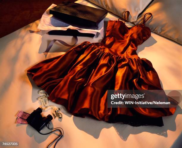 clothing on bed, elevated view - vestido-de-noche fotografías e imágenes de stock