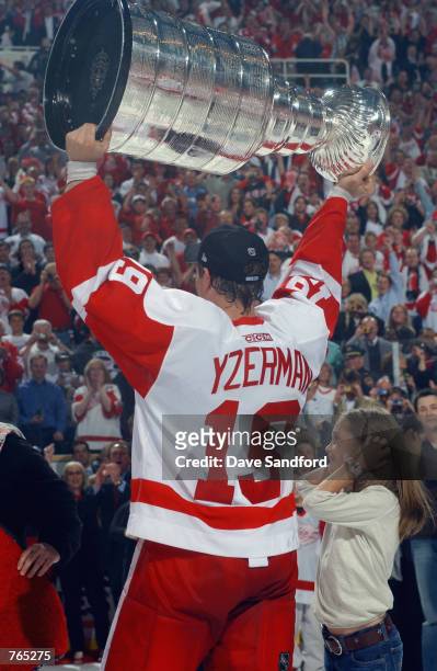 Steve Yzerman of the Detroit Red Wings raises the Stanley Cup after defeating the Carolina Hurricanes during game five of the NHL Stanley Cup Finals...