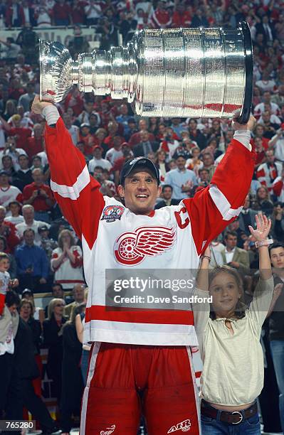 Steve Yzerman of the Detroit Red Wings raises the Stanley Cup after defeating the Carolina Hurricanes during game five of the NHL Stanley Cup Finals...