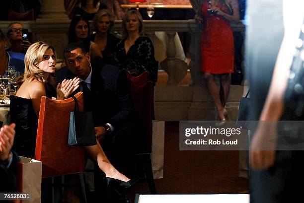 Baseball player Alex Rodriguez and wife Cynthia Rodriguez talk during Nicolas Felizola's fashion show at Daniel on September 5, 2007 in New York City.