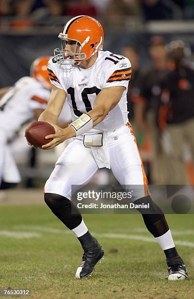 Quarterback Brady Quinn of the Cleveland Browns hands off the ball during the game against the Chicago Bears on August 30, 2007 at Soldier Field in...