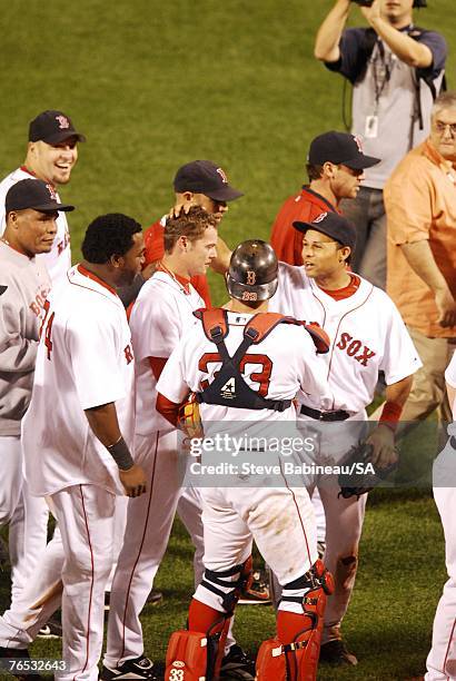 Clay Buchholz of the Boston Red Sox celebrates with teammates after the victory against the Baltimore Orioles on September 1, 2007 at Fenway Park in...