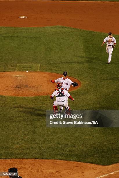 Clay Buchholz of the Boston Red Sox celebrates with teammates after the victory against the Baltimore Orioles on September 1, 2007 at Fenway Park in...