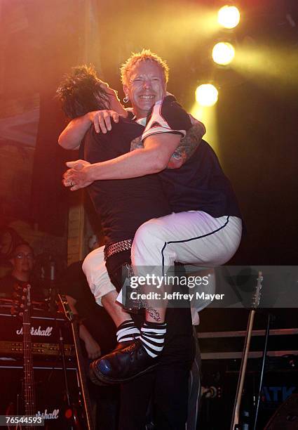 Musicians and winners Fall From Grace and musician Johnny Rotten attend the "Bodog Music Battle of the Bands" at the House of Blues on September 5,...