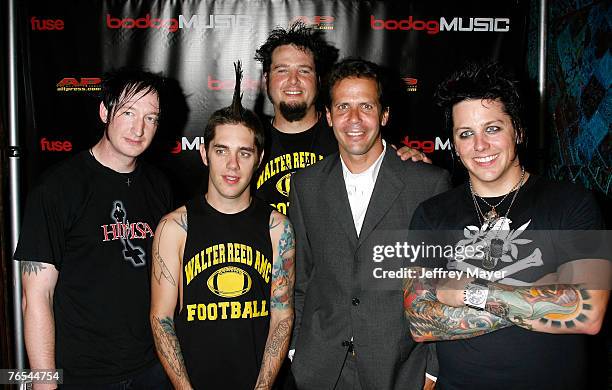 Musicians and winners Fall From Grace and Fuse TV President Eric Sherman attend the "Bodog Music Battle of the Bands" at the House of Blues on...