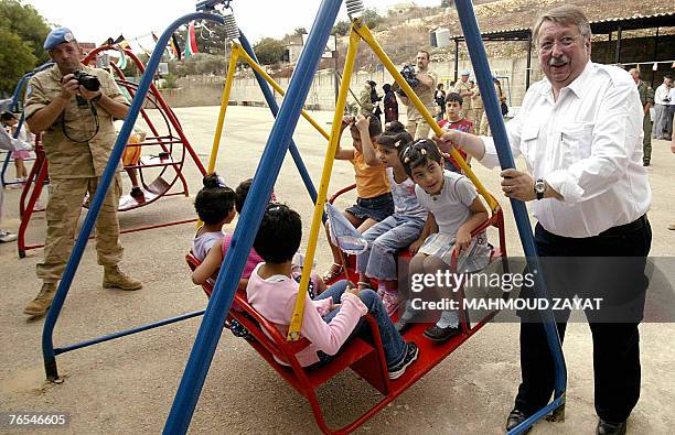 Belgian Defence Minister Andre Flahaut plays with Lebanese orphans during his visit to an orphanage house in the southern villlage of Tebnin, 06...