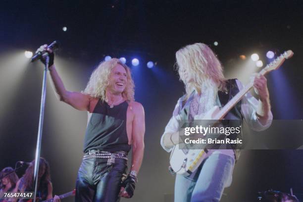 English rock singer David Coverdale and guitarist Adrian Vandenberg of Whitesnake perform together live on stage at the Hammersmith Apollo in London...