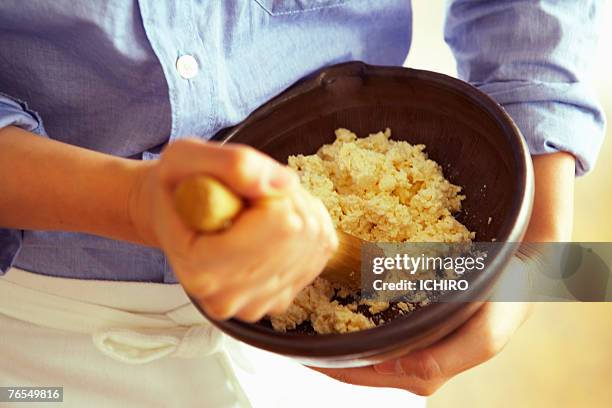 man mixing boiled eggs in bowl, mid section - mashing stock pictures, royalty-free photos & images