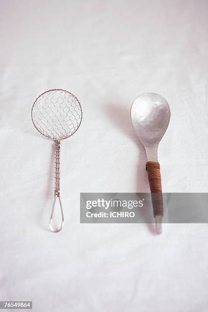 mesh ladle and metal spoon on table - lohas stock pictures, royalty-free photos & images