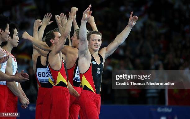 The German Team celebrates the 3rd place after the men's team final of the 40th World Artistic Gymnastics Championships on September 6, 2007 at the...