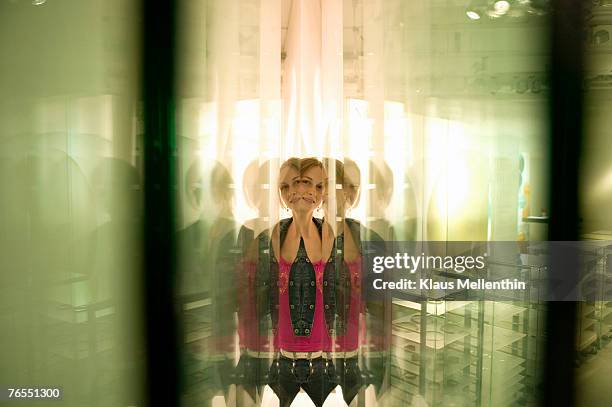 young woman reflected in glass panes - same person different looks stock pictures, royalty-free photos & images