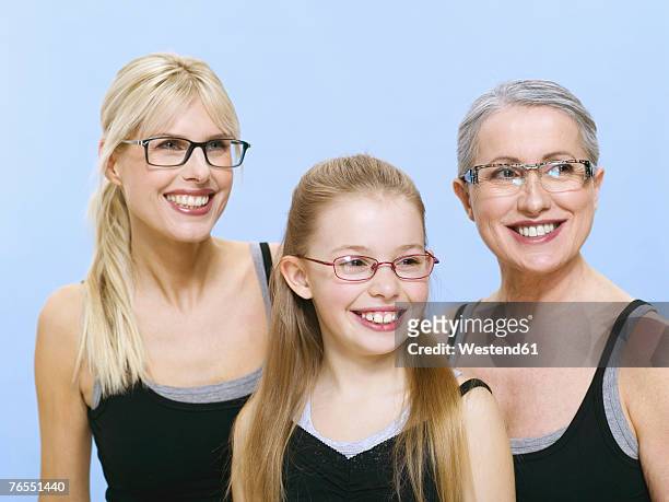 grandmother, mother and daughter wearing spectacles, portrait - all dressed the same stock pictures, royalty-free photos & images