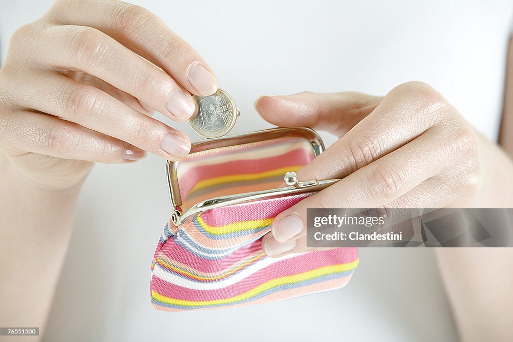 Woman with change purse, close-up