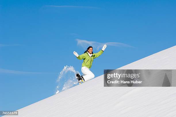 woman with snowshoes, running uphilll - northern european descent ストックフォトと画像