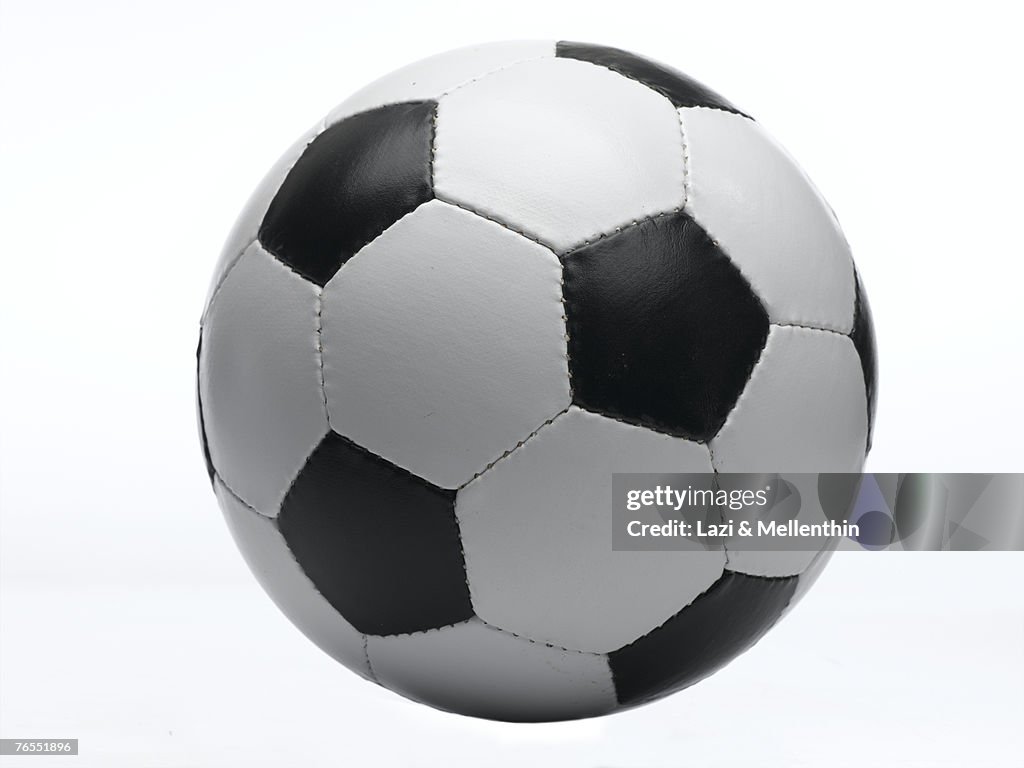 Football against white background, close-up