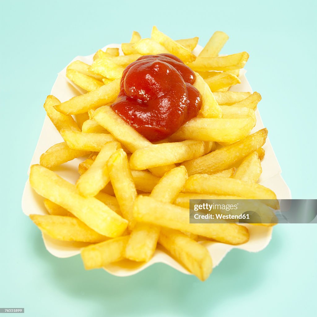 French fries with tomato ketchup, close-up