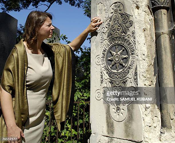 Historiographer Tina Walzer looks at a stone 16 August 2007 at the Jewish cemetery in Wahring, Vienna. Forgotten behind high walls in Vienna, the...