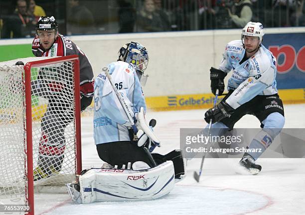 Goalkeeper Jean-Marc Pelletier of Hamburg Freezers controls the puck during the DEL match between Hamburg Freezers and Koelner Haie at the Koeln...