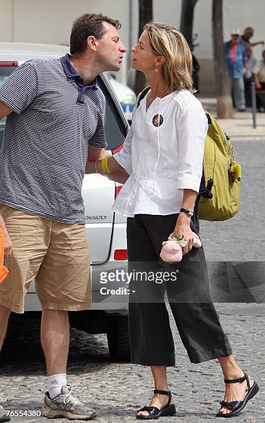 Gerry McCann and wife Kate, parents of missing four-year-old Briton Madeleine McCann, kiss before she enters the headquarters of Policia Judiciaria,...