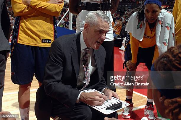 Head Coach Brian Winters of the Indiana Fever draws up a play during the WNBA game against the Detroit Shock in Game Two of the Eastern Conference...