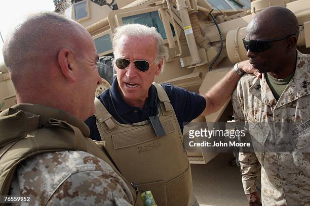 Democratic senator and Presidential candidate Joe Biden speaks with U.S. Marine generals before a development meeting between Iraqi and American...
