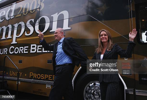 Actor and former U.S. Senator Fred Thompson waves to a crowd of people as he steps off his bus with his wife Jeri during a campaign stop September 6,...