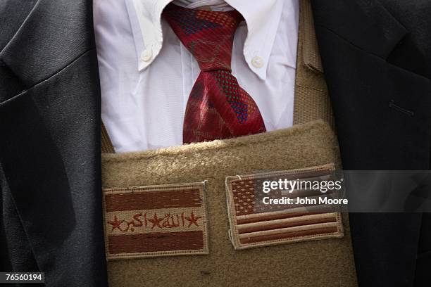 Iraqi and American flags decorate the front of the body armor of U.S. Ambassador Ryan Crocker September 6, 2007 in Ramadi, Anbar Province, Iraq....