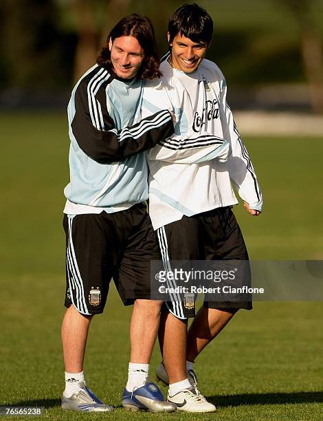 Lionel Messi and Sergio Aguero of Argentina share a joke during an Argentina training session held at Trinity GrammarSeptember 7, 2007 in Melbourne,...