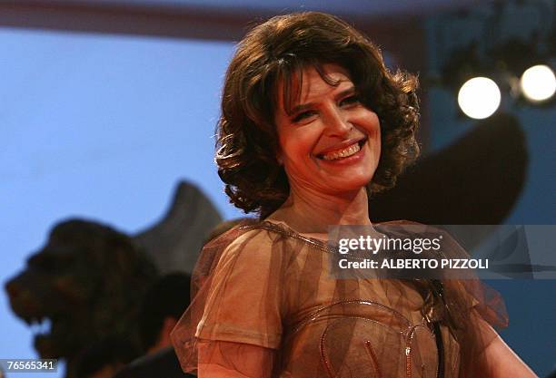 French actress Fanny Ardant poseS as she arrives for the screening of "L'ora di Punta" during the 64th Venice International Film Festival at Venice...