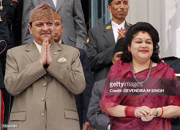 In this picture taken 06 September 2006, Nepal's King Gyanendra and Queen Komal watch a chariot procession carrying Kumari, a pre-pubescent girl...