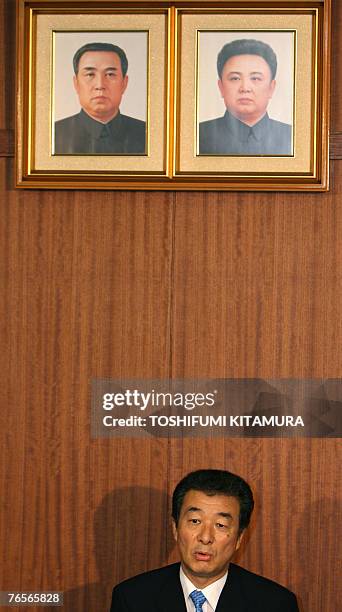 Nam Sung-U, Vice Chairman of the General Association of Korean Residents of Japan, speaks to journalists under a portrait of late North Korean leader...