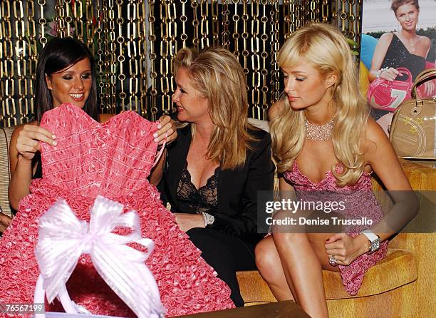 Nicky Hilton opens gift, a Betsey Johnson dress, from Kathy Hilton, with Paris Hilton