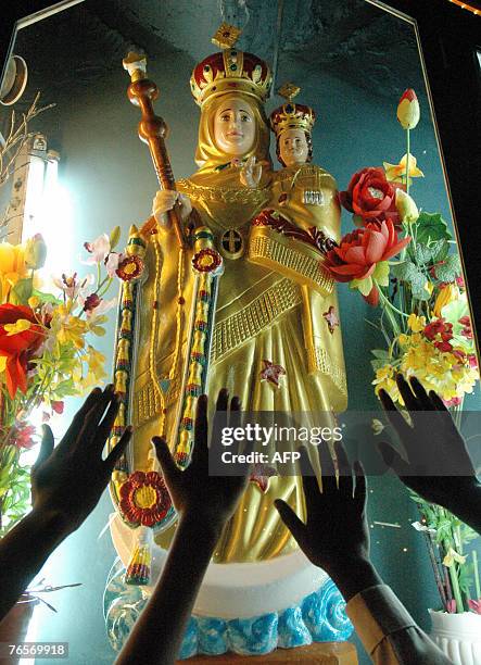 Indian Catholic devotees pray in front of the Mother Mary Statue at St Marys Church, Secunderabad, one of the twin cities of Hyderabad, 07 September...