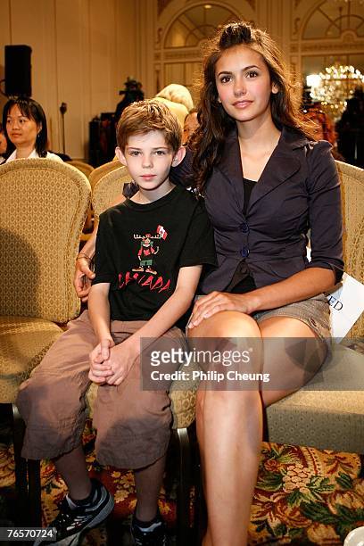 Actor Robbie Kay and actress Nina Dobrev wait for the start of the "Fugitive Pieces" press conference during the Toronto International Film Festival...