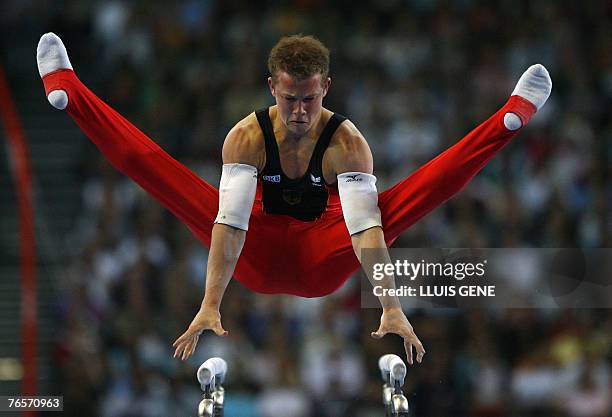 Fabian Hambuechen of Germany competes on the parallel bars during the men's individual all-around final of the 40th World Artistic Gymnastics...