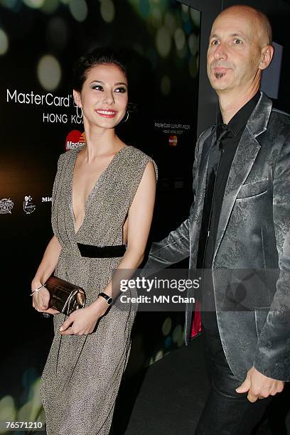 Singapore actress Denise Keller and Simon Lock, Managing Director of IMG Fashion Asia Pacific, attend the fashion show of designs by Vera Wang on the...