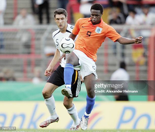 September 07: Kevin Pezzoni of Germany competes with Genero Zeefuik of the Netherlands during the U19 international friendly match between Germany...