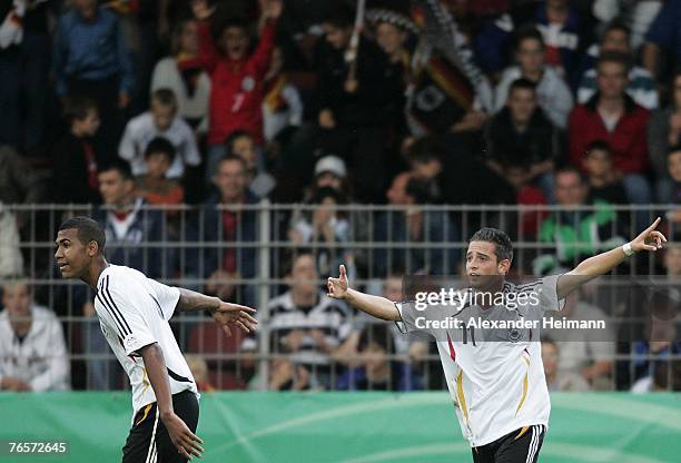 September 07: Eric Maxim Moting and Deniz Naki of Germany celebrate the 2:0 goal by Naki during the U19 international friendly match between Germany...