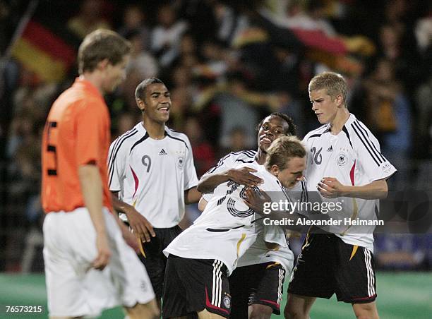 September 07: Manuel Fischer of Germany celebrates with his team mates after scoring his team's third goal during the U19 international friendly...