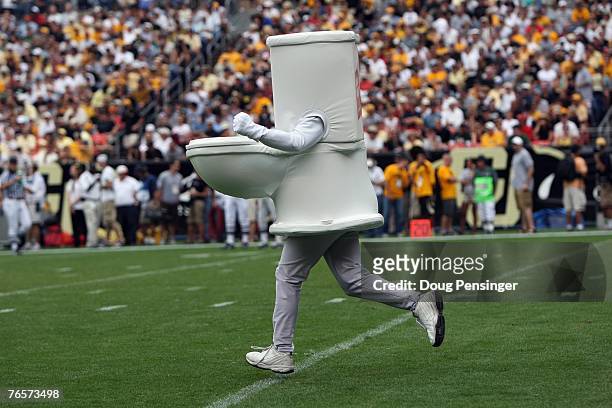 Man dressed as a toilet runs on the field during the Colorado State Rams game against the Colorado Buffaloes at INVESCO Field at Mile High on...