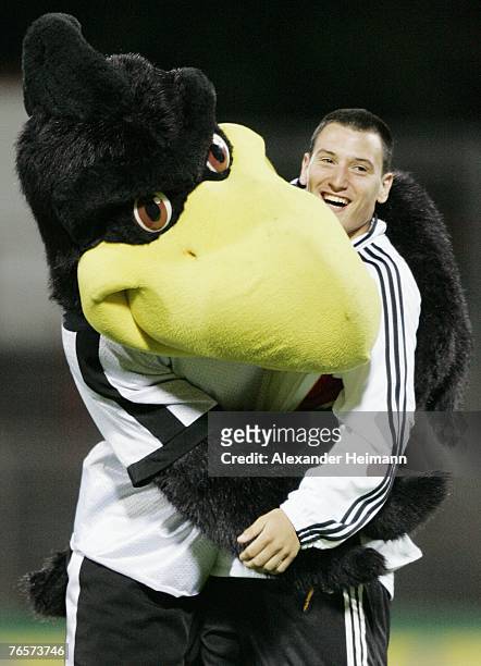September 07: German mascot Paule hugs Timo Gebhardt after the U19 international friendly match between Germany and Netherlands at the Niederrhein...