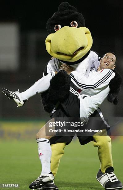September 07: German mascot Paule hugs Timo Gebhardt after the U19 international friendly match between Germany and Netherlands at the Niederrhein...