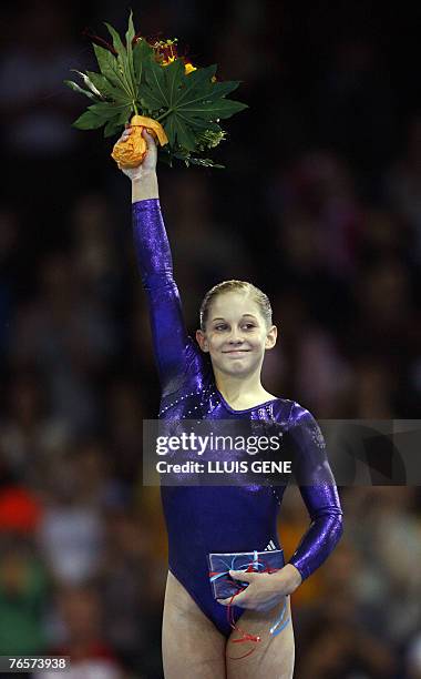 Shawn Johnson of US celebrates after wining the women's team final of the 40th World Artistic Gymnastics Championships 07 September 2007 at the...