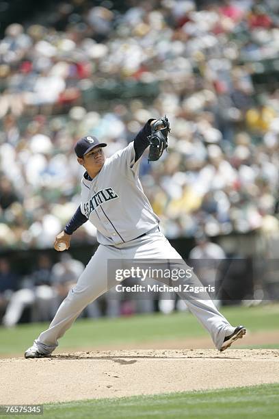 Felix Hernandez of the Seattle Mariners pitches during the game against the Oakland Athletics at the McAfee Coliseum in Oakland, California on July...