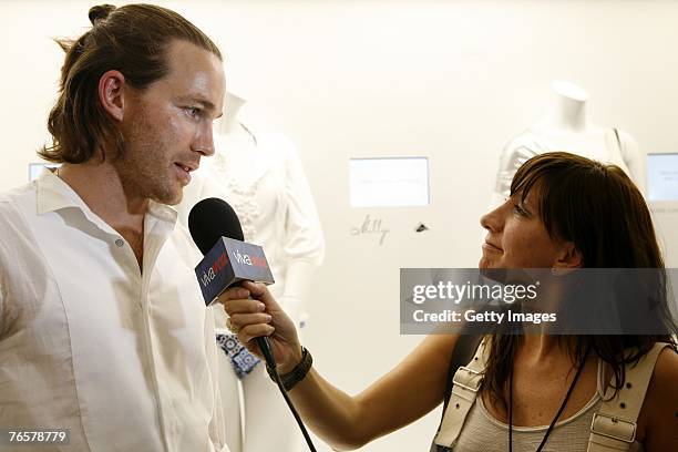 Rag and Bone designer David Neville speak during an interview at the Lycra booth in the fashion tents at Bryant Park during Mercedes-Benz Fashion...