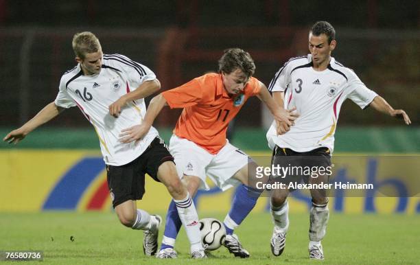 September 07: Sven Bender and Chian Kaptan of Germany compete with Jules Reimerink of the Netherlands during the U19 international friendly match...